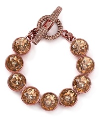 Love heavy metal? Rock out with this striking Juicy Couture bracelet, which features an all around of rose gold stones. Love heavy metal? Rock out with this striking Juicy Couture bracelet, which features an all around of rose gold stones.