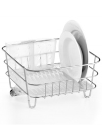 A go-anywhere, do-anything attitude simplifies your lifestyle. This compact dish rack slips into the sink or perches on your countertop for an effortless versatility that cleans up your routine. A rust- and corrosion-resistant design features a cup holder and removable utensil holder. 5-year warranty. A go-anywhere, do-anything attitude simplifies your lifestyle. This compact dish rack slips into the sink or perches on your countertop for an effortless versatility that cleans up your routine. A rust- and corrosion-resistant design features a cup holder and removable utensil holder. 5-year warranty.
