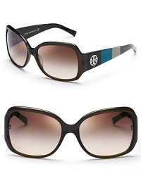 Nail one of this season's top trends in Tory Burch's colorblocked sunglasses. Stand-out olive, turquoise and gray sides feature Tory's signature logo. Nail one of this season's top trends in Tory Burch's colorblocked sunglasses. Stand-out olive, turquoise and gray sides feature Tory's signature logo.