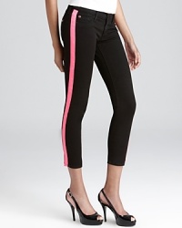 Contrast stripes down the legs add a pop of color to these Hudson skinny jeans. Contrast stripes down the legs add a pop of color to these Hudson skinny jeans.