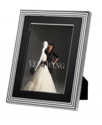 Add new elegance to beautiful memories with Vera Wang's With Love Noir picture frame. Geometric detail lends metallic shimmer to chic black enamel in a home accent that invokes modern and deco design. Add new elegance to beautiful memories with Vera Wang's With Love Noir picture frame. Geometric detail lends metallic shimmer to chic black enamel in a home accent that invokes modern and deco design.