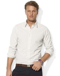 Washed for a soft hand and timeworn appearance, a trim-fitting sport shirt is crafted from dobby-woven cotton with a sleek striped pattern. Washed for a soft hand and timeworn appearance, a trim-fitting sport shirt is crafted from dobby-woven cotton with a sleek striped pattern.