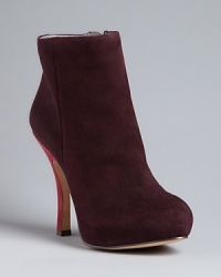 Dark, plush perfection; Rosegold brings pure luxury into these understated-yet-statement making booties, with elegant curved, snake-embossed heels. Dark, plush perfection; Rosegold brings pure luxury into these understated-yet-statement making booties, with elegant curved, snake-embossed heels.