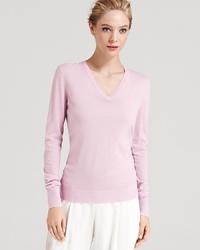 This classic V-neck Theory sweater is crafted from a lightweight wool that's perfect for now and easy to layer in the cooler months to come. This classic V-neck Theory sweater is crafted from a lightweight wool that's perfect for now and easy to layer in the cooler months to come.