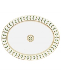 For any elegant holiday affair the Bernardaud Constance Dinnerware Collection makes for timeless presentation of your seasonal fare. Ornate design inspired by the Empire Period with gold outlined acorn and oak leaves that symbolize strength and longevity. A dash a sage rims each piece behind a golden laurel vine while touches of red with gold trim further complement the pattern. A dramatic addition to any holiday table, also can be used as a display piece.
