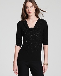 A constellation of beading sparkles from a stunningly draped Eileen Fisher sweater for an effortlessly elegant look. Wear the style with sleek trousers to illuminate the day, then ignite the night. A constellation of beading sparkles from a stunningly draped Eileen Fisher sweater for an effortlessly elegant look. Wear the style with sleek trousers to illuminate the day, then ignite the night.