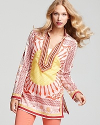 A bead-embellished neckline and ribbon trim elevate this tie-dyed Tory Burch cotton voile tunic, for a modern take on a vintage classic. A bead-embellished neckline and ribbon trim elevate this tie-dyed Tory Burch cotton voile tunic, for a modern take on a vintage classic.