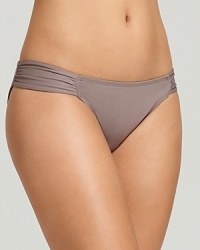 L*Space's Foxy tab bikini boasts a classic silhouette with subtle, gathered details. L*Space's Foxy tab bikini boasts a classic silhouette with subtle, gathered details.