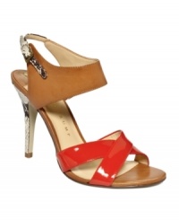 Sky-high sexiness: The Meadea sandals by Ivanka Trump elevate your night out with bright patent and rich leather straps. The python print at the heel adds necessary bite. Sky-high sexiness: The Meadea sandals by Ivanka Trump elevate your night out with bright patent and rich leather straps. The python print at the heel adds necessary bite.