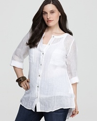 Sheer linen perfection, this lightweight Eileen Fisher tunic eases beautifully over pants and skirts alike, and doubles as a relaxed beach cover-up. Sheer linen perfection, this lightweight Eileen Fisher tunic eases beautifully over pants and skirts alike, and doubles as a relaxed beach cover-up.