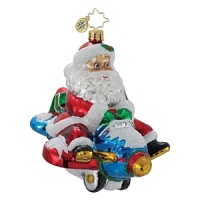 Santa takes an alternate mode of transportation to deliver toys, hitching a ride on a blue jet. Santa takes an alternate mode of transportation to deliver toys, hitching a ride on a blue jet.