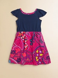 A tropical floral pattern enlivens this classic silhouette, shaped with a pretty gathered waist and flounced cap sleeves.JewelneckFlounced sleevesElasticized waistFull skirtPull-on styleCottonMachine washImported A tropical floral pattern enlivens this classic silhouette, shaped with a pretty gathered waist and flounced cap sleeves.JewelneckFlounced sleevesElasticized waistFull skirtPull-on styleCottonMachine washImported