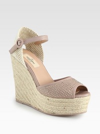Backed by soft woven canvas, this heightened espadrille silhouette has a leather upper with glistening metal studs. Covered wedge, 5 (125mm)Covered platform, 1¾ (45mm)Compares to a 3¼ heel (80mm)Woven canvas and leather upper with metal studsAdjustable leather ankle strapLeather liningRubber trek solePadded insoleMade in Italy Backed by soft woven canvas, this heightened espadrille silhouette has a leather upper with glistening metal studs. Covered wedge, 5 (125mm)Covered platform, 1¾ (45mm)Compares to a 3¼ heel (80mm)Woven canvas and leather upper with metal studsAdjustable leather ankle strapLeather liningRubber trek solePadded insoleMade in Italy