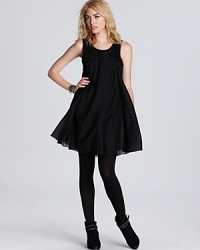 Strut down the sidewalk with the greatest of ease in a mystical Free People trapeze dress, complete with silver beading and allover pleating. Strut down the sidewalk with the greatest of ease in a mystical Free People trapeze dress, complete with silver beading and allover pleating.