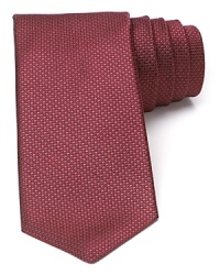 A micro houndstooth pattern lends a subtle look to this classic silk tie from Michael Kors. A micro houndstooth pattern lends a subtle look to this classic silk tie from Michael Kors.