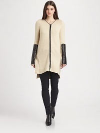 This long, cozy knit cardigan gets its edgy appeal from supple leather patches.V necklineFront zip with contrast trimLong sleevesLeather arm patchesVented hemlineAbout 34 from shoulder to hemWool/camel hair/polyamideDry cleanImportedModel shown is 5'10 (177cm) wearing US size Small. This long, cozy knit cardigan gets its edgy appeal from supple leather patches.V necklineFront zip with contrast trimLong sleevesLeather arm patchesVented hemlineAbout 34 from shoulder to hemWool/camel hair/polyamideDry cleanImportedModel shown is 5'10 (177cm) wearing US size Small.