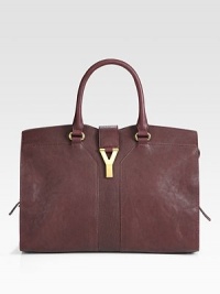 An incredibly roomy silhouette crafted from sumptuous leather, adorned with signature Y hardware.Double top handles, 5 dropMagnetic strap over zip closureProtective metal feetOne inside zip pocketTwo inside open pocketsLinen lining14¼W X 9H X 5½DMade in Italy An incredibly roomy silhouette crafted from sumptuous leather, adorned with signature Y hardware.Double top handles, 5 dropMagnetic strap over zip closureProtective metal feetOne inside zip pocketTwo inside open pocketsLinen lining14¼W X 9H X 5½DMade in Italy