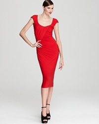 In a chic midi length, this Donna Karan New York dress puts a signature twist on sophisticated style with precisely tailored folds and gathers at the front. In a chic midi length, this Donna Karan New York dress puts a signature twist on sophisticated style with precisely tailored folds and gathers at the front.