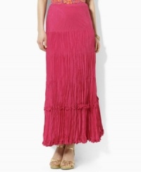 A cotton-silk maxi skirt is crafted in a crinkled silhouette for a unique breezy look. A cotton-silk maxi skirt is crafted in a crinkled silhouette for a unique breezy look.