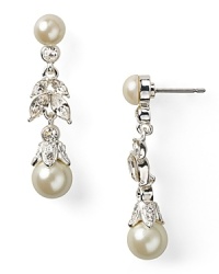 Forgo the garden variety jewels in favor of Carolee's delicate floral teardrops. Come party time, these pearl and crystal-adorned earrings dazzle set against a simple sheath dress. Forgo the garden variety jewels in favor of Carolee's delicate floral teardrops. Come party time, these pearl and crystal-adorned earrings dazzle set against a simple sheath dress.