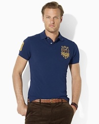 Designed in a trim fit with a slimmer body and a shorter hem, this short-sleeved polo shirt in breathable cotton mesh is embroidered with a Polo Match crest for heritage style. Designed in a trim fit with a slimmer body and a shorter hem, this short-sleeved polo shirt in breathable cotton mesh is embroidered with a Polo Match crest for heritage style.