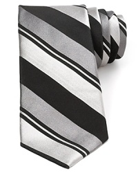 Wide bar stripes are augmented neatly with thinner tonal bands, creating a dynamic pattern on this pure Italian silk tie from Valentino, a distinguished offering for your fine collection. Wide bar stripes are augmented neatly with thinner tonal bands, creating a dynamic pattern on this pure Italian silk tie from Valentino, a distinguished offering for your fine collection.