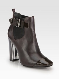 This leather design is given a punch of personality with patent leather accents and an unexpected metallic heel. Patent leather and metallic-covered heel, 4 (100mm)Leather and patent leather upper with elastic goresAdjustable patent leather ankle strapLeather lining and solePadded insoleImported This leather design is given a punch of personality with patent leather accents and an unexpected metallic heel. Patent leather and metallic-covered heel, 4 (100mm)Leather and patent leather upper with elastic goresAdjustable patent leather ankle strapLeather lining and solePadded insoleImported