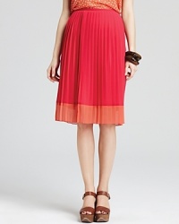 Delicate pleats pair with delectable hues for a Jones New York Collection skirt brimming with feminine charm. Play up the midi silhouette with sky-high wedges. Delicate pleats pair with delectable hues for a Jones New York Collection skirt brimming with feminine charm. Play up the midi silhouette with sky-high wedges.