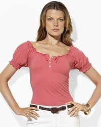A bohemian smocked neckline and soft cotton jersey construction make this peasant Lauren Ralph Lauren tee an essential for the season. A bohemian smocked neckline and soft cotton jersey construction make this peasant Lauren Ralph Lauren tee an essential for the season.