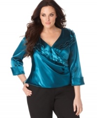 R&M Richards' plus size top makes a shimmering statement with its ruffle-tiered surplice neckline and cuffed sleeves. (Clearance) R&M Richards' plus size top makes a shimmering statement with its ruffle-tiered surplice neckline and cuffed sleeves. (Clearance)