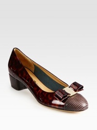 Glistening patent leather pump has a slight heel, printed leather toecap and logoed bow adornment. Self-covered heel, 1 (25mm)Patent leather and printed leather upperLeather lining and solePadded insoleMade in Italy Glistening patent leather pump has a slight heel, printed leather toecap and logoed bow adornment. Self-covered heel, 1 (25mm)Patent leather and printed leather upperLeather lining and solePadded insoleMade in Italy