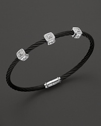 From the Celtic Noir Collection, a stackable bangle in white gold and and black PVD with diamond stations. Designed by Charriol. From the Celtic Noir Collection, a stackable bangle in white gold and and black PVD with diamond stations. Designed by Charriol.