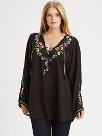 Embroidered flowers adorn this flowing top with self ties at its decolletage-flattering neckline. Ties at split neckPull-on styleEmbroidered detailsPull-on styleCurved hemAbout 32 from shoulder to hemRayonMachine washImported Embroidered flowers adorn this flowing top with self ties at its decolletage-flattering neckline. Ties at split neckPull-on styleEmbroidered detailsPull-on styleCurved hemAbout 32 from shoulder to hemRayonMachine washImported