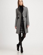 Contrast details add a sleek finish to this architectural wool coat. Contrast stand collarBreast welt pocketButton frontAttached belt detailFaux leather trimAbout 35 from shoulder to hemWoolDry cleanImportedModel shown is 5'11 (180cm) wearing US size 4. 