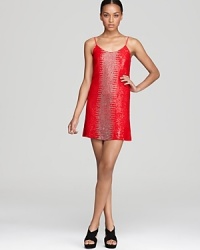 Sparkle in this Parker beaded and sequined dress. Flaunting a shining ikat pattern, this stunner masters soirée style with exotic flair. Sparkle in this Parker beaded and sequined dress. Flaunting a shining ikat pattern, this stunner masters soirée style with exotic flair.
