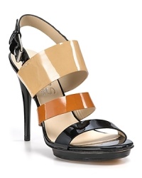 A rich mix of black and browns in gleaming patent gives KORS Michael Kors' platform sandals stunning versatility. A rich mix of black and browns in gleaming patent gives KORS Michael Kors' platform sandals stunning versatility.