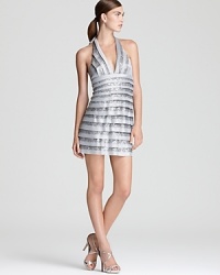 Tiers of sequins and satin lend a shimmering look to BCBGMAXAZRIA's showstopping halter dress. Tiers of sequins and satin lend a shimmering look to BCBGMAXAZRIA's showstopping halter dress.
