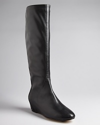 Set on delicate, covered demi wedges, these tall black boots are the height of sleek; by Ted Baker. Set on delicate, covered demi wedges, these tall black boots are the height of sleek; by Ted Baker.