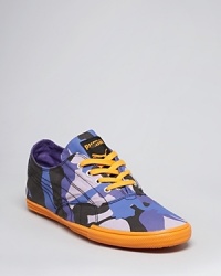 Sporty, hip urban sneakers from PUMA invigorate your street-smart style with an unexpected camo pattern offset with a bright contrast color. Sporty, hip urban sneakers from PUMA invigorate your street-smart style with an unexpected camo pattern offset with a bright contrast color.
