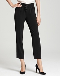 Add understated cool to your casual look these DKNYC cropped pants. A slim silhouette and drawstring waist impart pared-down sophistication. Add understated cool to your casual look these DKNYC cropped pants. A slim silhouette and drawstring waist impart pared-down sophistication.