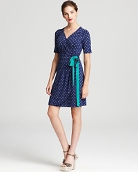 Dainty polka dots dance across this Lilly Pulitzer wrap dress, finished with a contrast belt for a playful yet polished approach to everyday style. Dainty polka dots dance across this Lilly Pulitzer wrap dress, finished with a contrast belt for a playful yet polished approach to everyday style.