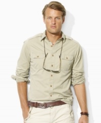 A trim-fitting military shirt in durable cotton twill channels rugged safari style with bold bellows pockets at the chest. A trim-fitting military shirt in durable cotton twill channels rugged safari style with bold bellows pockets at the chest.