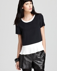 Black and white with a charming pop of a peplum, this MARC BY MARC JACOBS top is right on trend for fall with striking color block details. Black and white with a charming pop of a peplum, this MARC BY MARC JACOBS top is right on trend for fall with striking color block details.