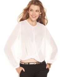 Sheer chiffon drapes softly and forms a novel crisscross design on this dream top from XOXO. Sheer chiffon drapes softly and forms a novel crisscross design on this dream top from XOXO.