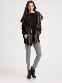 Lush shearling with a sueded outside finish, all in a draped open-front silhouette.Hooded shawl collarOpen frontPatch pocketsAbout 28 from shoulder to hemGenuine lamb shearlingDry clean by a fur specialistImportedFur origin: ChinaModel shown is 5'10 (177cm) wearing US size Small. Lush shearling with a sueded outside finish, all in a draped open-front silhouette.Hooded shawl collarOpen frontPatch pocketsAbout 28 from shoulder to hemGenuine lamb shearlingDry clean by a fur specialistImportedFur origin: ChinaModel shown is 5'10 (177cm) wearing US size Small.