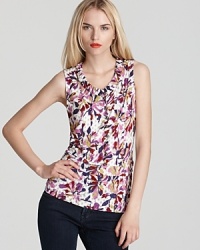 Layered florals are embellished with platinum buttons on this pleated, v neck MARC by MARC JACOBS top. Layered florals are embellished with platinum buttons on this pleated, v neck MARC by MARC JACOBS top.