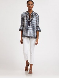 A striking combination of colors create a requisite design for the season. The gilded details on the tassel ends are especially glamorous.Tassel and ruffle details at necklineTiered, ruffle cuffs on three-quarter sleevesPull-on styleAbout 27 from shoulder to hem52% silk/48% rayonDry cleanImported Model shown is 5'9 (175cm) wearing US size 4. A striking combination of colors create a requisite design for the season. The gilded details on the tassel ends are especially glamorous.Tassel and ruffle details at necklineTiered, ruffle cuffs on three-quarter sleevesPull-on styleAbout 27 from shoulder to hem52% silk/48% rayonDry cleanImported Model shown is 5'9 (175cm) wearing US size 4.
