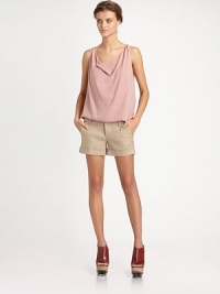 A sleek sheath of matte silk, draped elegantly at the neckline.CowlneckSleevelessShirttail hemSilkDry cleanImportedModel shown is 5'10 (177cm) wearing US size Small. A sleek sheath of matte silk, draped elegantly at the neckline.CowlneckSleevelessShirttail hemSilkDry cleanImportedModel shown is 5'10 (177cm) wearing US size Small.