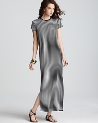 Cut a graphic silhouette in this MICHAEL Michael Kors maxi dress sharply styled with shoulder-to-shoe stripes. Punctuate the optic silhouette with acid-bright accents. Cut a graphic silhouette in this MICHAEL Michael Kors maxi dress sharply styled with shoulder-to-shoe stripes. Punctuate the optic silhouette with acid-bright accents.