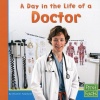 A Day in the Life of a Doctor (First Facts: Community Helpers at Work)